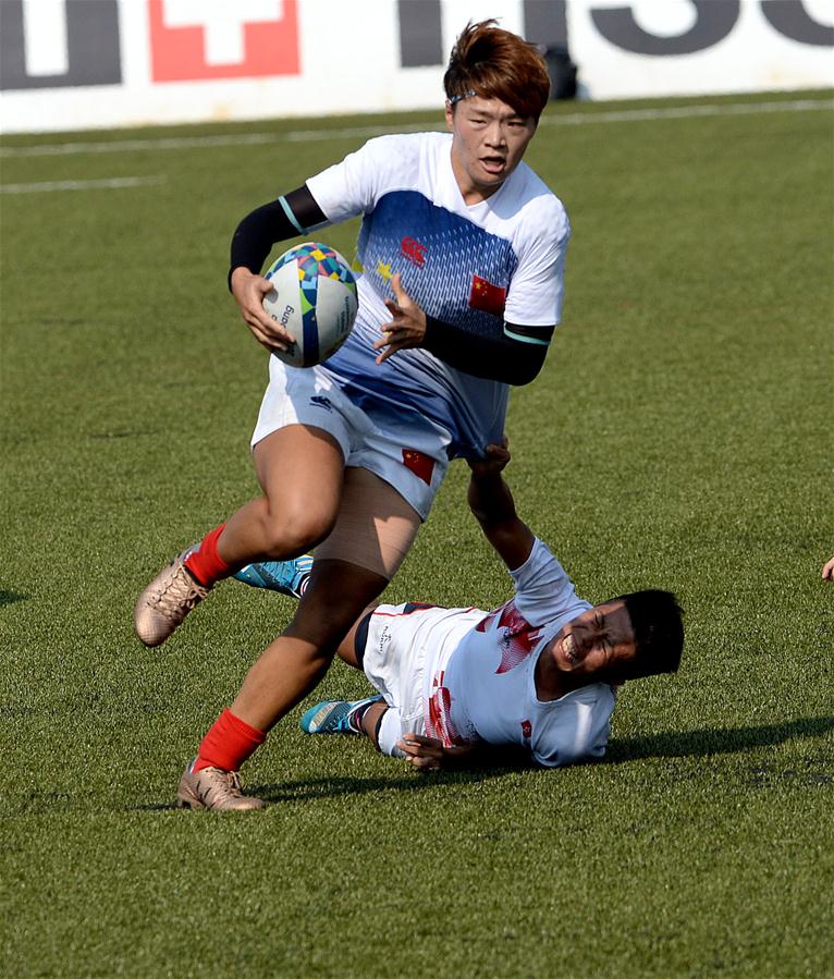 斐济组合在橄榄球混合团体比赛中战胜对手 斐济组合在橄榄球混合团体比赛中战胜对手